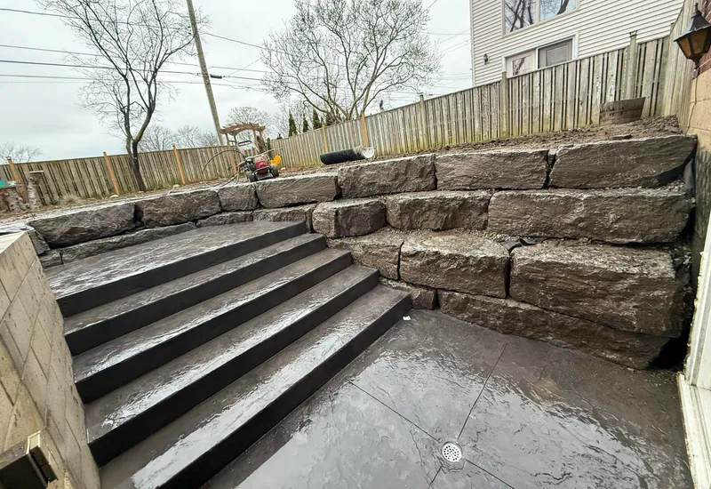 Completed basement walkout with landscaping