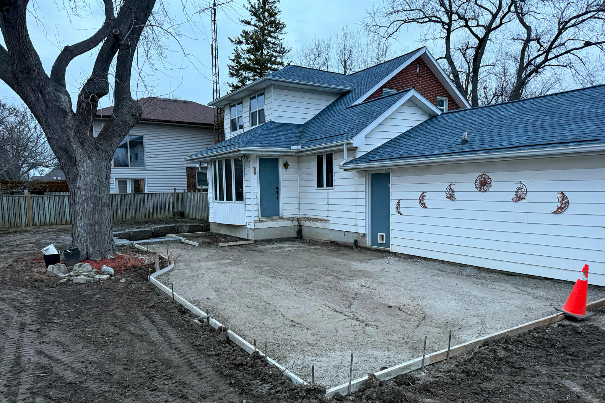 In-progress basement walkout with patio extension