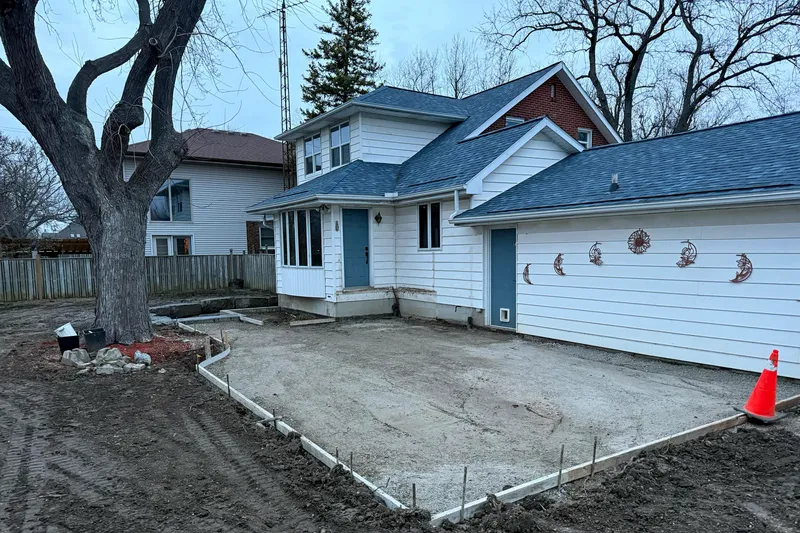 In-progress basement walkout with patio extension