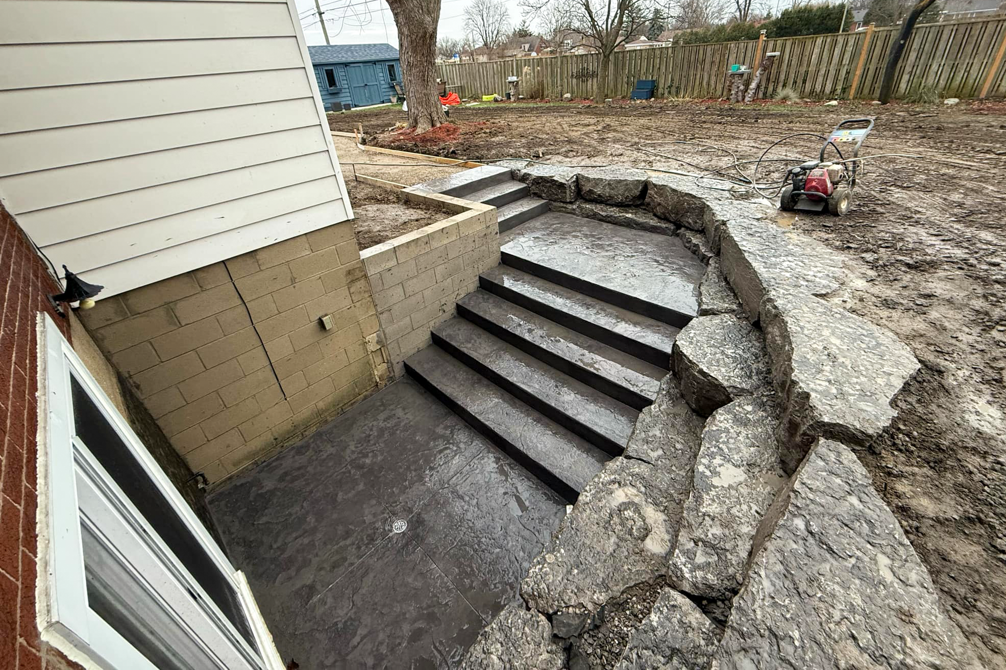 Completed concrete steps for basement walkout