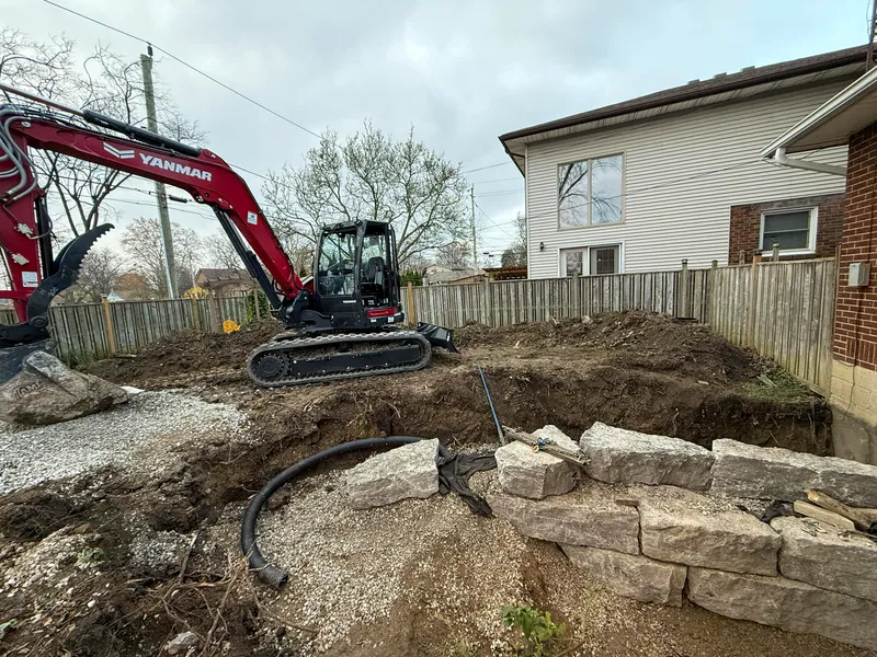 Stone retaining wall for basement walkout
