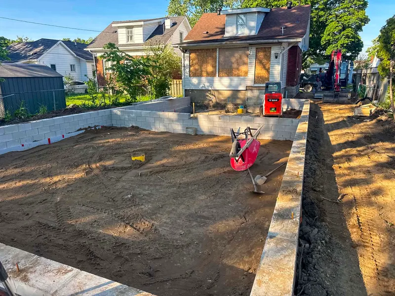 Block foundation walls ready for backfill on a home addition