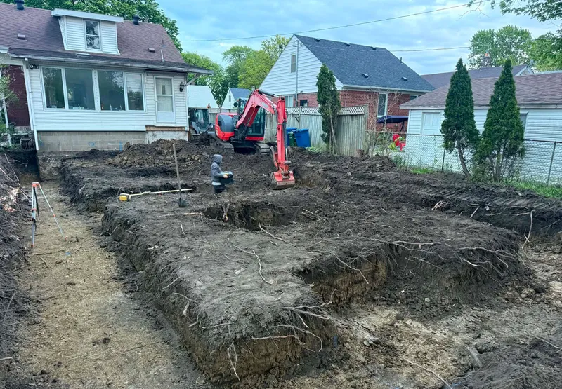 Completed foundation footing excavation for a residential addition