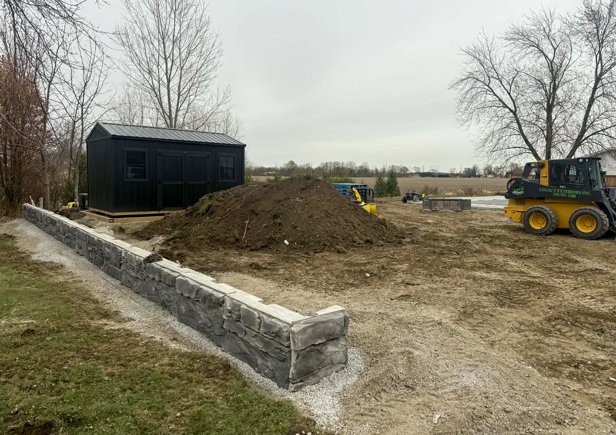 Large retaining wall project by Legacy Exteriors Windsor