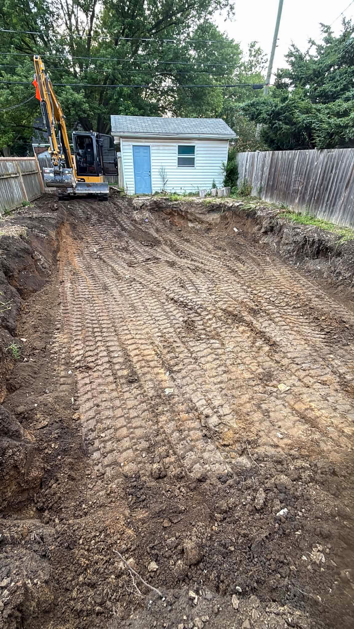 Backfilled and rough-graded yard after complete pool removal