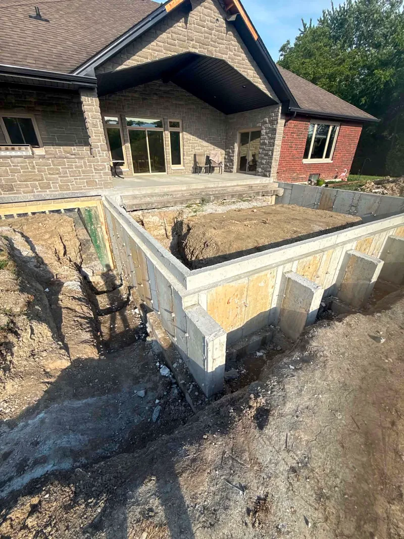 Excavation around new foundation walls for a home addition